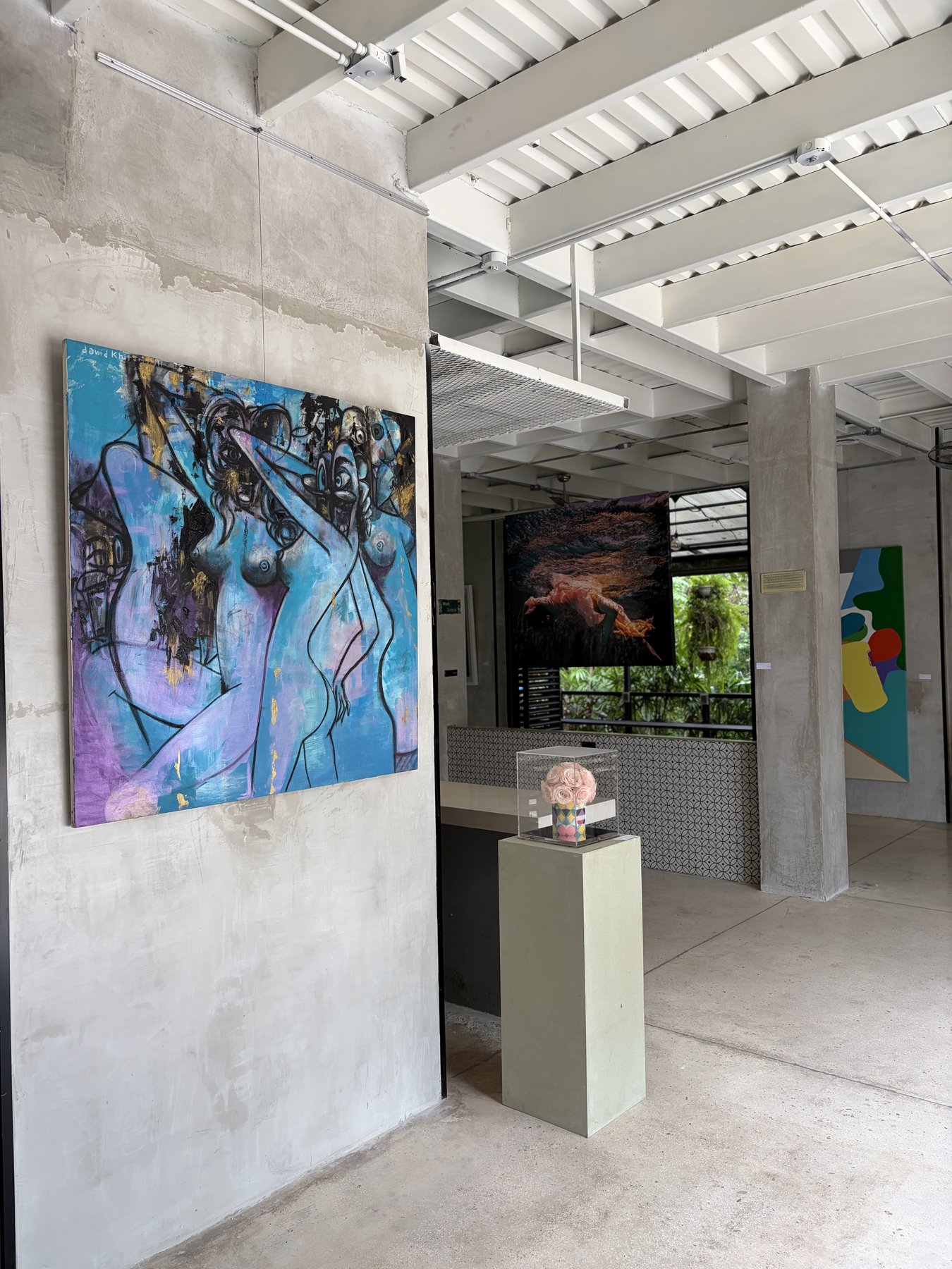 Gallery corner with David Khitarishvili painting and rose display