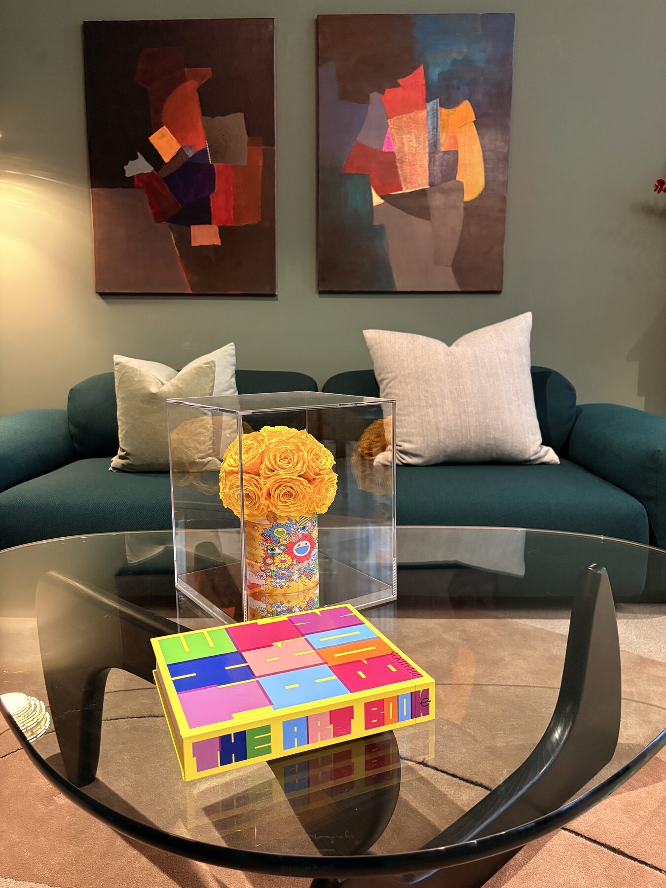 Two abstract paintings above a teal sofa in a living room, Aspen, Colorado